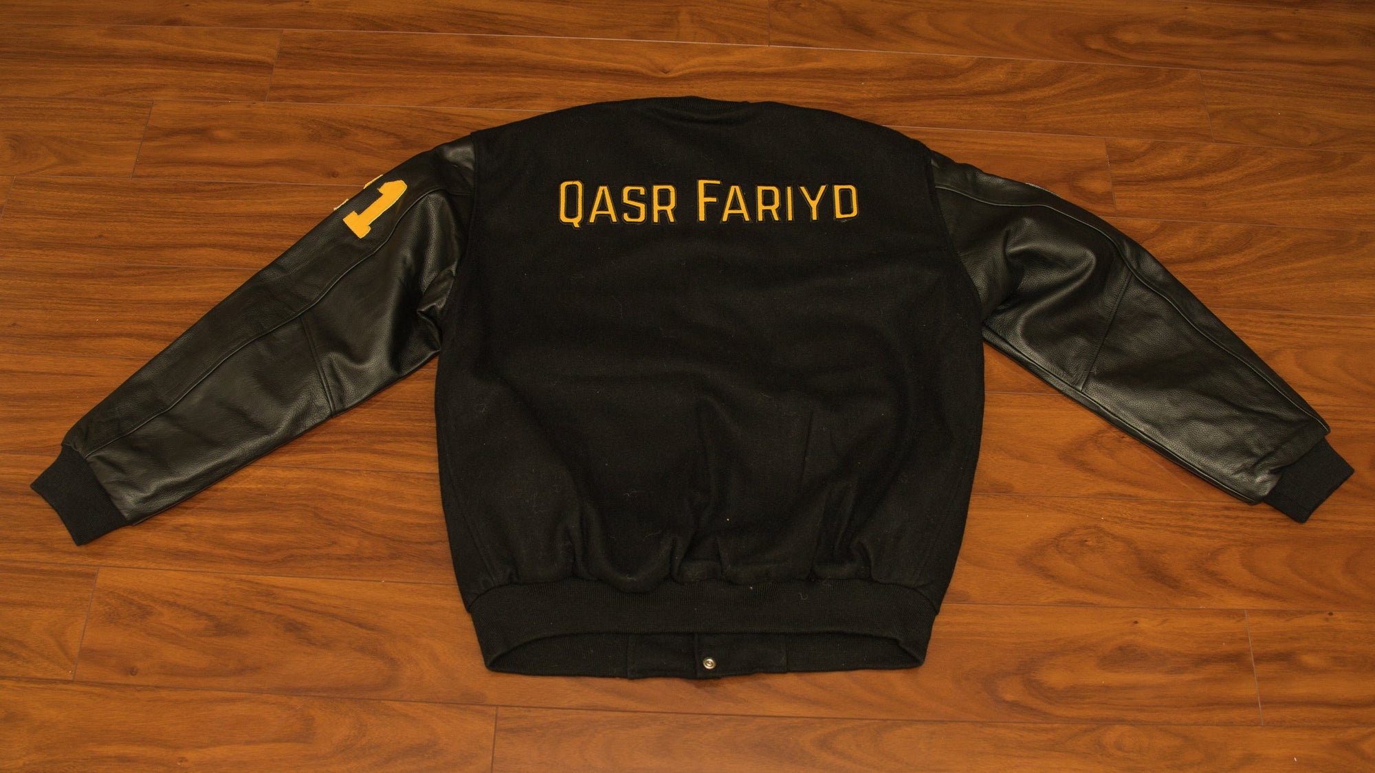 Qasr Fariyd Black Varsity Jacket Yellow Logo